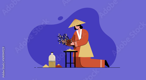 Person in traditional Asian attire and conical hat kneeling, preparing a bundle of plants for a ritual or cultural celebration. Represents tradition, spirituality, and cultural lifestyle.