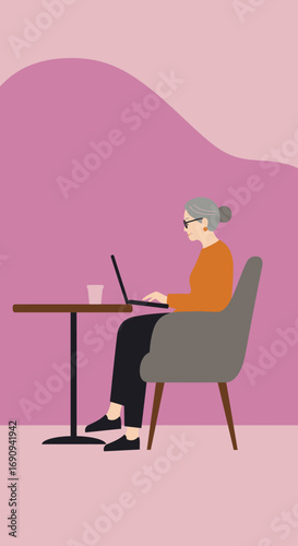 Senior woman actively working on a laptop at a table, representing digital literacy, remote work, and a modern, engaged lifestyle for older adults.