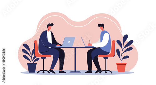 Two business professionals collaborating with laptops at a table, representing teamwork, office work, or modern business communication.
