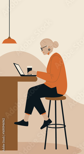 Focused senior woman working remotely on her laptop at a modern cafe, showcasing active senior lifestyle, digital engagement, and productive independent work.