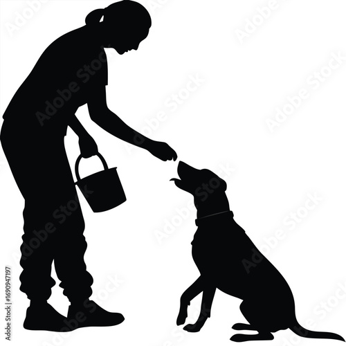 Person feeding dog