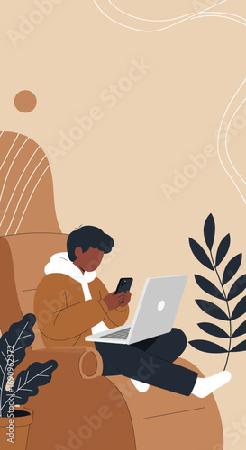 Comfortable young person using laptop and smartphone at home. Represents remote work, online learning, digital communication, and modern lifestyle flexibility.