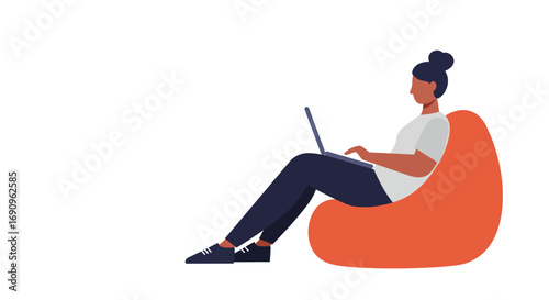 Young woman comfortably working on her laptop while sitting on a beanbag chair. Ideal for remote work, online learning, or casual computing concepts.