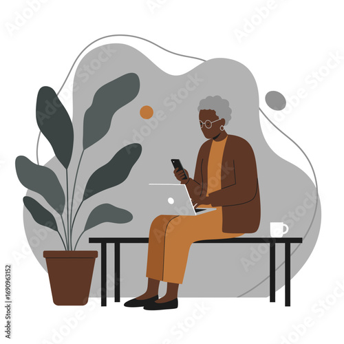 Senior woman focused on laptop and smartphone, embracing technology in a modern setting. Ideal for themes of remote work, education, or connected lifestyle.