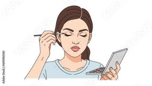 Young woman applying eyeliner with a brush while looking in a compact mirror focused on her makeup routine for a polished look
