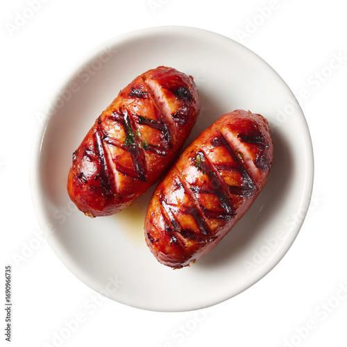 grilled chorizo sausages on white plate, top view
