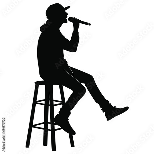 Singer sitting on stool
