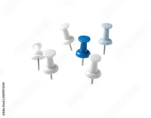Assorted pushpins, various shades of white and a single blue pin, clustered together