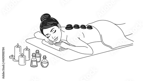 Relaxing hot stone massage therapy session with aromatic oils and lit candles for ultimate spa wellness and rejuvenation