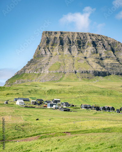 mountain landscape with blue sky and clouds, Faroe Islands, Vagar, Gasadalur village