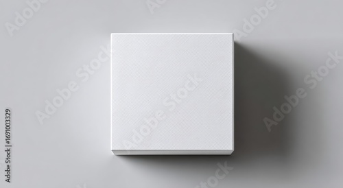 Blank white box on a light gray surface