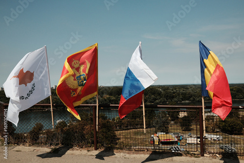 Flags of Cyprus, Montenegro, Russia, and Romania waving at Kalemegdan Fortress in Belgrade