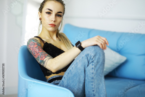 Free Download The girl is resting in the loft. Young stylish girl posing in the bathroom. - GFXLoad