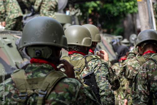 Military troops of Colombia with tanks and armored vehicles, Army preparing defense and attack strategy, Soldiers mobilizing for battlefield readiness. High quality photo