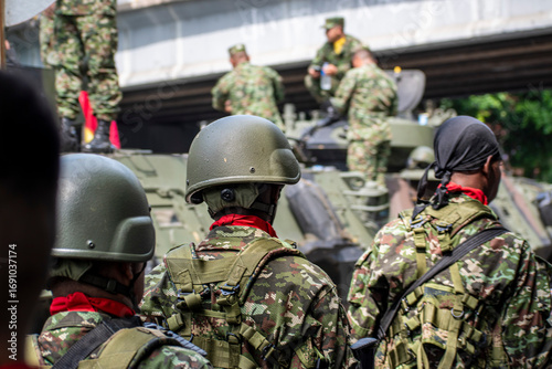 Colombian army preparing for battle, Soldiers getting ready for combat, Armed forces in military readiness. High quality photo