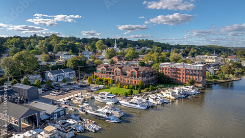 Mystic Connecticut overlooking the scenic Mystic River just south of the Bascule Bridge. Boats, local business, river, and skyline all in high definition beautiful color.