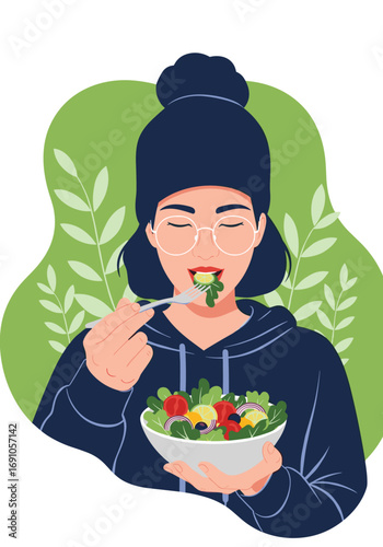 A young person enjoys a fresh healthy salad full of nutritious ingredients