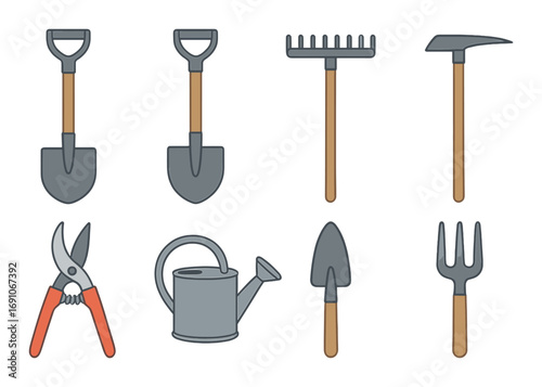 Collection of essential garden tools on wooden background