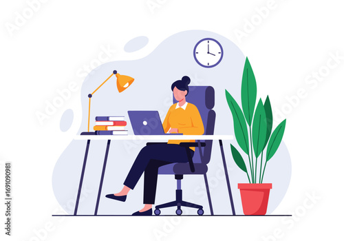 Young woman working on laptop at desk with plant and lamp in office