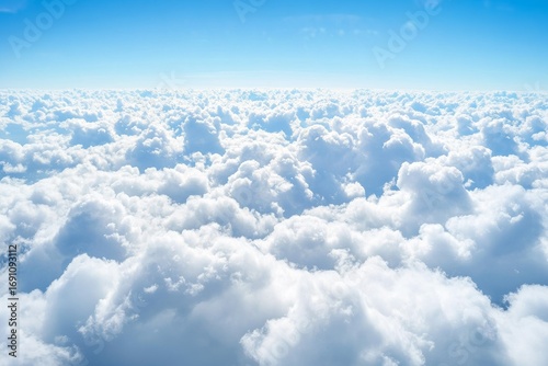Breathtaking High-Altitude Cloudscape Capturing a Serene Expanse of Soft, Billowy Clouds Against a Tranquil Blue Sky Evoking Feelings of Freedom, Peace and Vastness for Nature Lovers