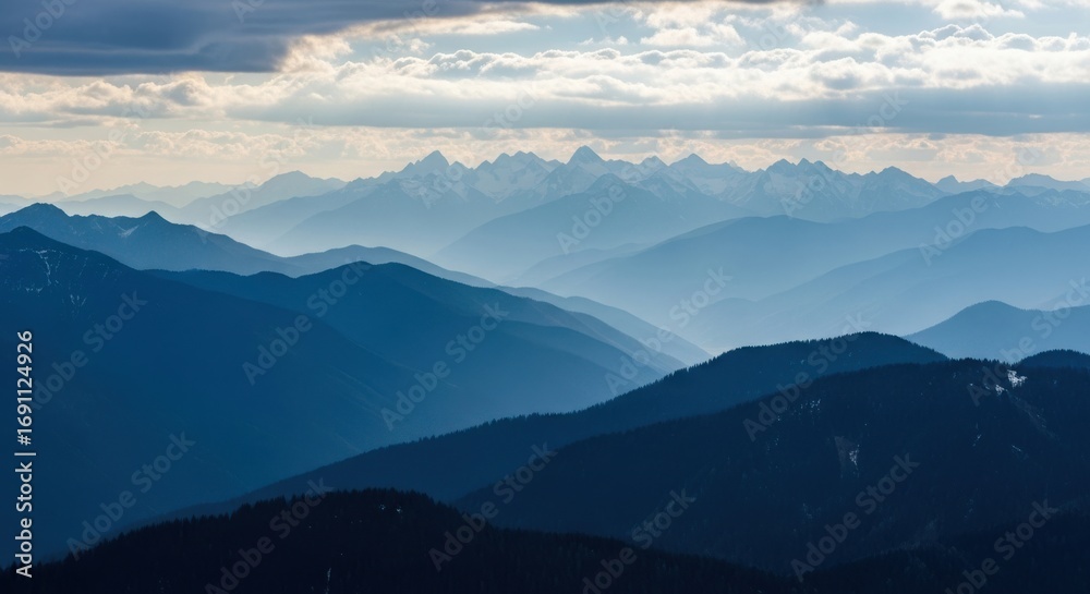 Fototapeta premium Majestic Mountain Ranges Fade into the Hazy Horizon