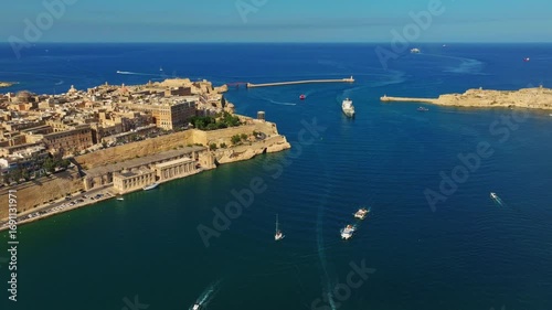 Drone view of Grand harbour of Valletta. Lighthouse, sea, boats, ships. Malta