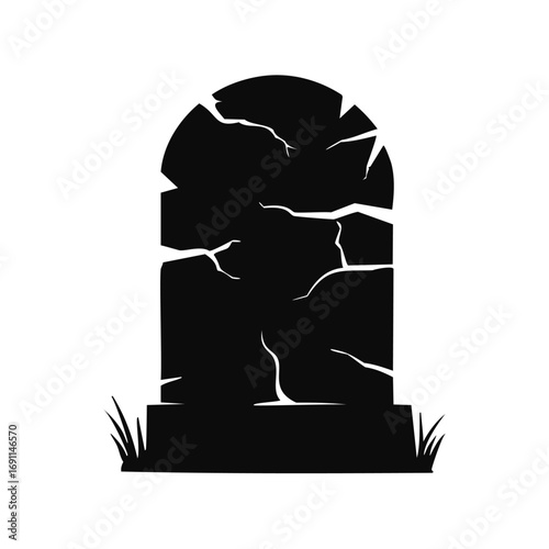 Cracked tombstone silhouette with grass grave marker cemetery