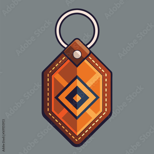 Decorative geometric leather keychain with ring and decorative features in shades of brown and orange on a grey background
