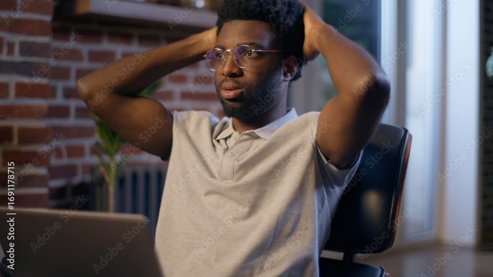 Naklejka premium Businessman ethnic African American business man employer online laptop working deadline night overwork evening office manager tired exhausted worker trouble computer task problem frustrated upset