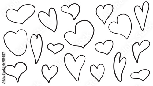set of various hearts hand drawn in black in doodle style on white background