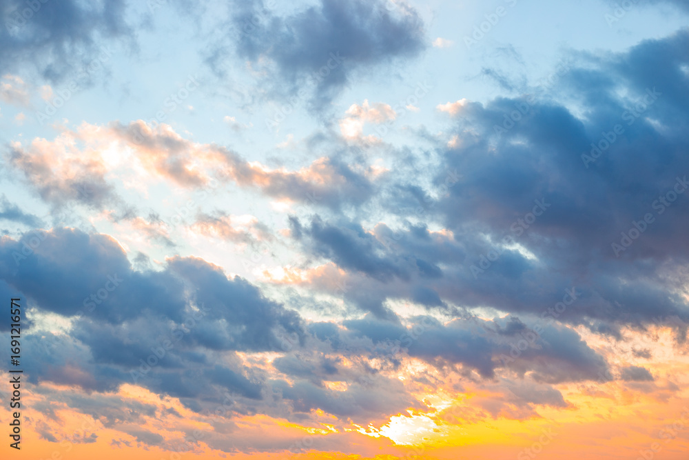 Fototapeta premium Sky full of colorful clouds at sunset. Skyscape