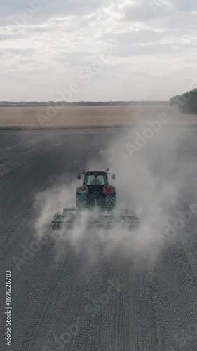 Tractor Plowing Field Slow Motion Aerial Vertical Shot