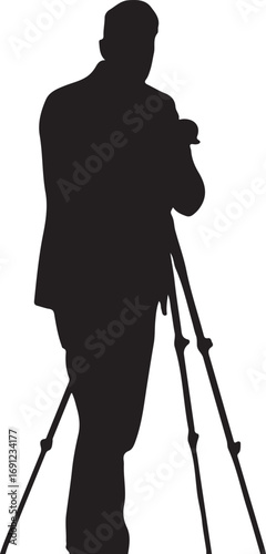 Black silhouette of a man in a suit holding a camera on a tripod person photographer