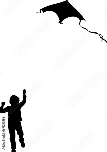 Joyful child with raised arms chases a kite soaring high in the sky
