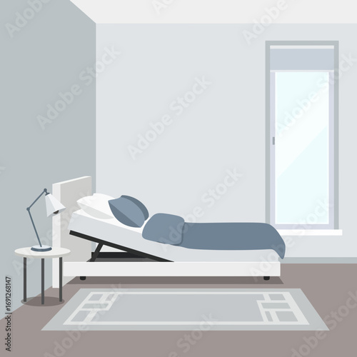 Bedroom with adjustable bed and bedside table near a window.