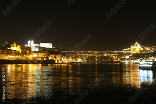 Illuminated Porto Waterfront Reflected in the Douro River