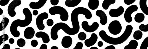 Black and white seamless pattern with bold doodle strokes. Abstract squiggles, dots and curvy shapes create a playful graphic background