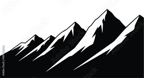 Majestic snow-capped mountain range under a clear sky, symbolizing adventure and natural beauty.