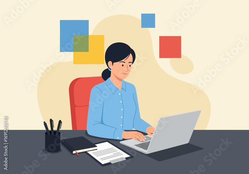 Focused Woman Working on Laptop at Desk