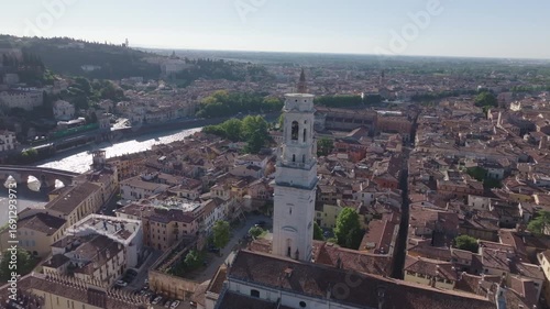 Wallpaper Mural Aerial drone footage of Verona, Italy, reveals the city’s charming mix of historic buildings, lush green hills, and the Adige River. The view highlights Verona’s unique blend of culture, architecture, Torontodigital.ca