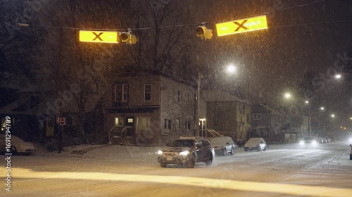 A winter storm dumps snow on a Toronto residential neighbourhood at night
