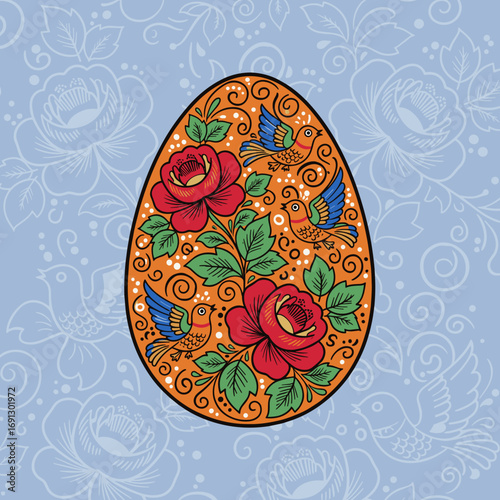 Decorative Easter egg with floral and bird designs on blue background  
