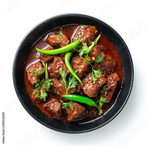 beef karahi in black bowl on top view
