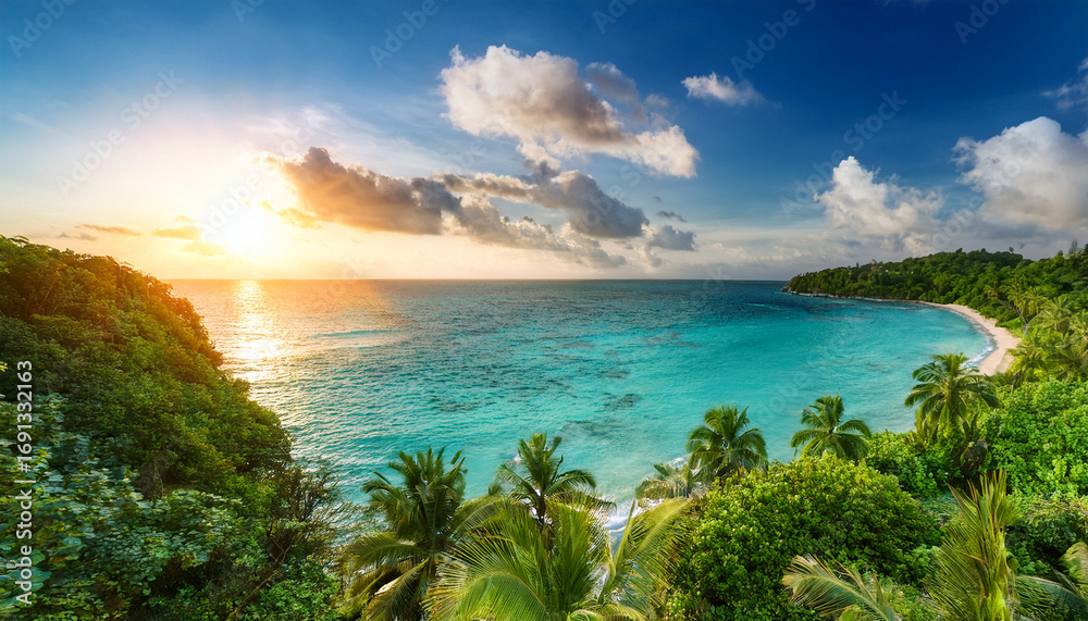 Fototapeta premium Serene Tropical Paradise With Lush Greenery And Sparkling Turquoise Water At Sunset