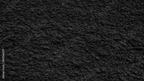 Black wall with a rough, grainy texture as a textured background for a web banner template page design.
