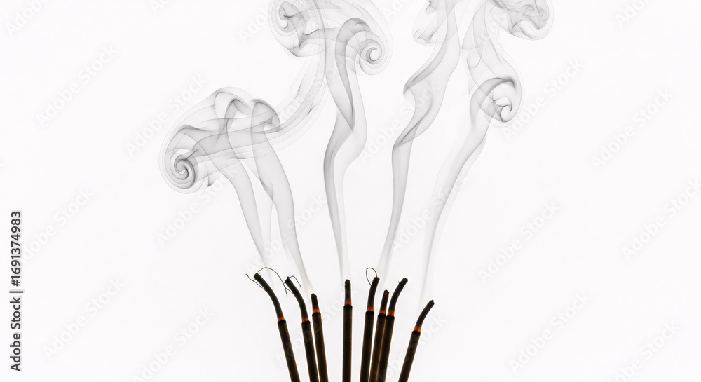 Fototapeta premium Graceful incense smoke swirls upwards, creating an atmosphere of calm and tranquility for meditation and relaxation.
