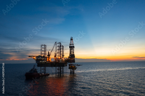 Wallpaper Mural Aerial view of offshore jack up rig in a shipyard during sunset for oil and gas exploration and production.  Torontodigital.ca