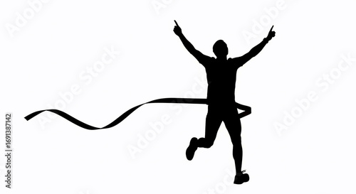 Silhouette of a triumphant runner crossing the finish line with arms raised in victory
