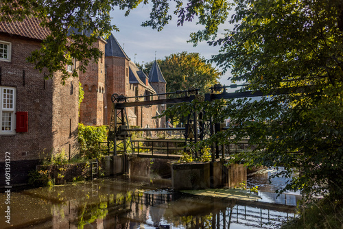 Tableau sur toile Dam sluice gate and waterworks outside historic double gated access medieval cit