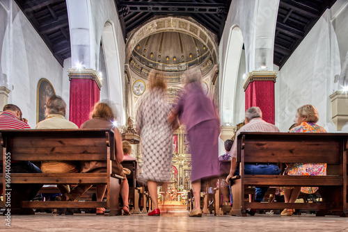 Seville, Spain, March 30 2009, Elderly women walk to pews for Mass at San Lorenzo Church